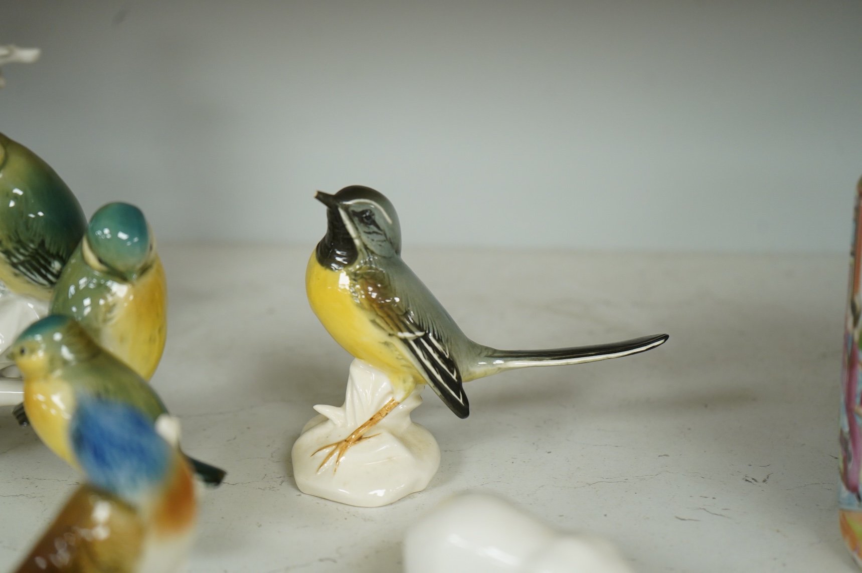 A collection of Copenhagen and other German porcelain birds, tallest 20cm